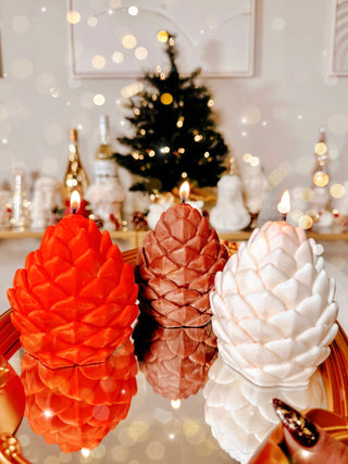 Holiday Lavish Pinecones Candle Set of 3 surrounded by Christmas decor.
