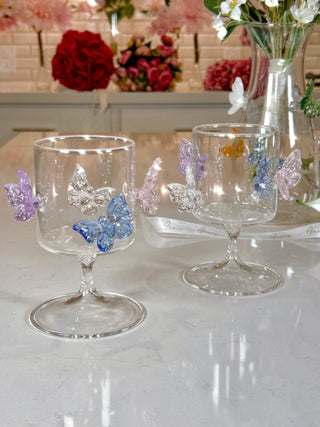 Butterfly Euphoria Wine Glass Cup Set of 2 atop a luxurious white marble kitchen island.