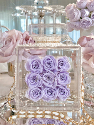 Everlasting Roses in Parfum Box in Plum showcasing its white leather, and golden chain.