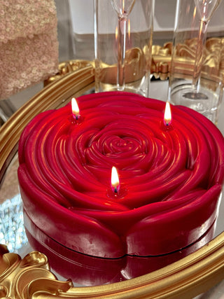3-Wick Brilliant Rose Candle in Red with all wicks lit.