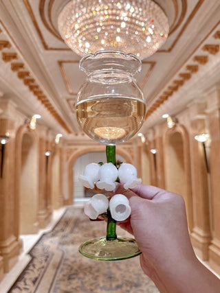 ‘Lily of the Valley’ Sculpted Wine Glass in a luxurious old-money hotel's hallway.