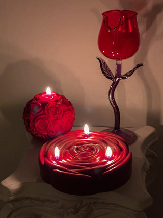 3-Wick Brilliant Rose Candle fully lit.