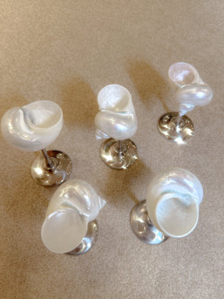 A view of five seashell enchante cups from above.