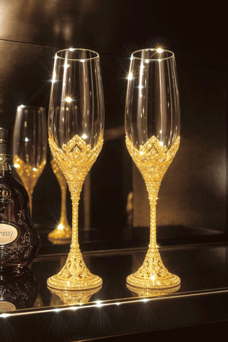 Two Crowné Embossed Diamonds Champagne Flutes set atop a glass bar shelf.