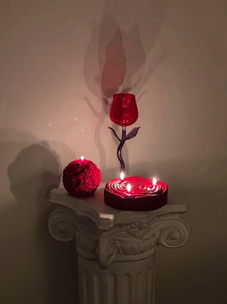 3-Wick Brilliant Rose Candle in Red with lit wicks.