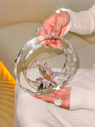 A woman delicately holding a Enchanting Crystal Flower Blossom - XL.