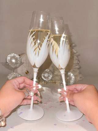 Two people toasting with the Feather Bliss Champagne Flute Set of 2.