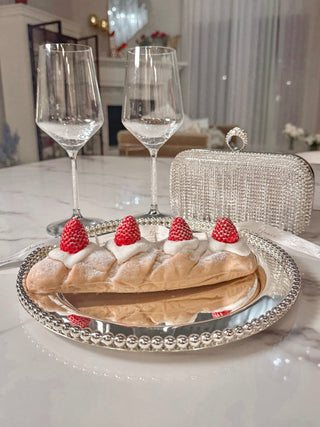Strawberry & Cream Bread Candle showcased next to 'We Are One' glass cups.