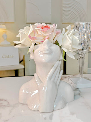The Jovie Ceramic Vase decorated with multi-colored flowers.