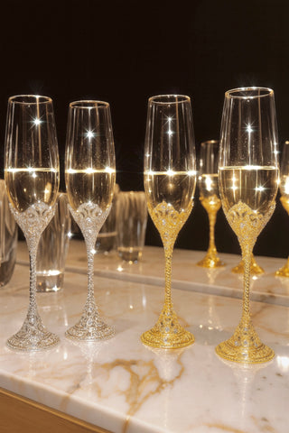 Crowné Embossed Diamonds Champagne Flutes in Gold and Silver atop a marble console table.