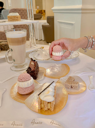 Iridescent natural, seashell dessert plates with natural seashell spoons – perfect for pastries and sweets.