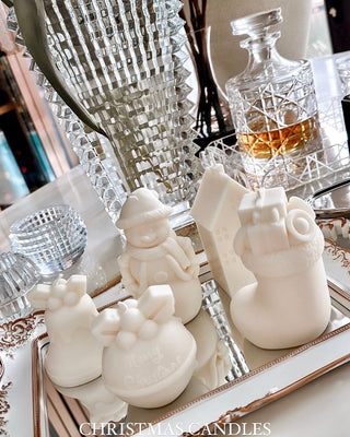 Christmas Wonderland Candle Set of 4 in White on a mirror tray.