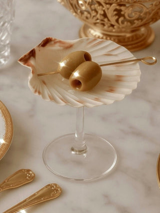 A Shelle Oceana Cup Set displayed on a marble dining table in the summer sun.