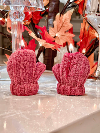 Knitted Mitten Candle Set with lit flames in a cozy living room.