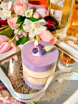 Blueberry Cheese Cake Candle styled atop a mirror tray.