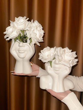 The “Her” & Angelica Ceramic Vase Set of 2 filled with large, blooming white florals.