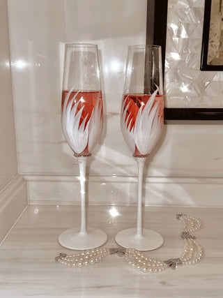 Feather Bliss Champagne Flute filled with sparkling pink rosé, enjoyed during a beautiful wedding ceremony.