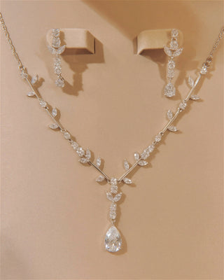 Lumière Flora Necklace & Earring Set shimmering in its soft, clamshell jewelry box.