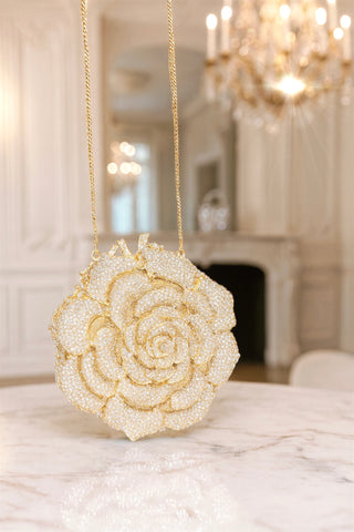 Rosette d’Or Mini Clutch in a luxurious living room.