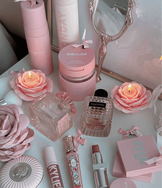 La France Rose Candle Set of 3 displayed next to luxurious home goods.