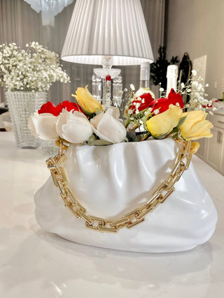 Sylvie Cloud Handbag with Gold Chain Resin Vase with a beautiful bouquet.