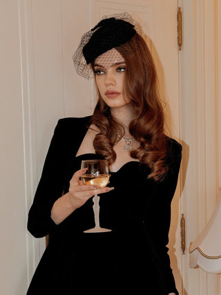 A woman at a special event holding a Venus Goddess Sculpture Wine Flute.
