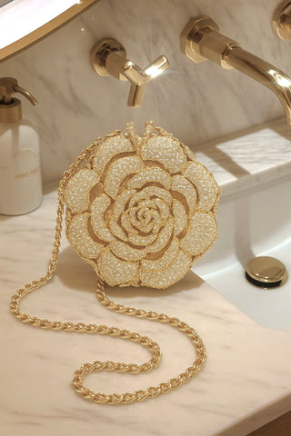 Rosette d’Or Mini Clutch, features an attachable gold chain.