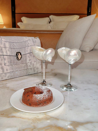 The Seashell Enchanté Cup™️ Set of 2 in Crystal featured in a 5-star hotel.