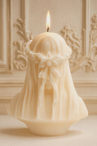 The Amour, Anaïs™️ candle features an elegant, enigmatic veiled lady.