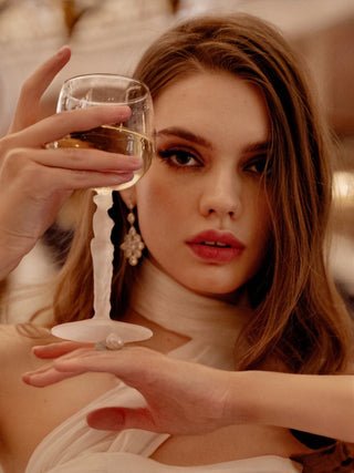 Venus Goddess Sculpture Wine Flute being toasted by a model.