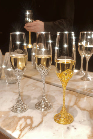 A man enjoying champagne with a Crowné Embossed Diamonds Champagne Flute.