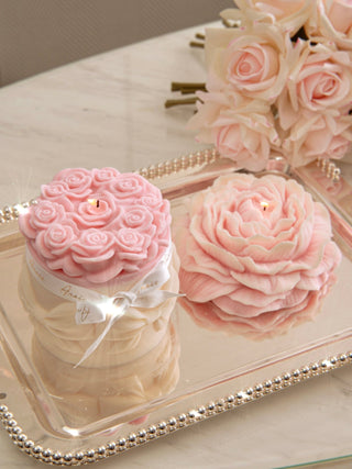 Lavish Rose Bouquet Candle in Pink - XXL next to the Blooming Peony Candle.