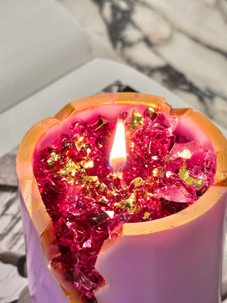 18K Gold Amethyst Crystal Candle with a lit flame.