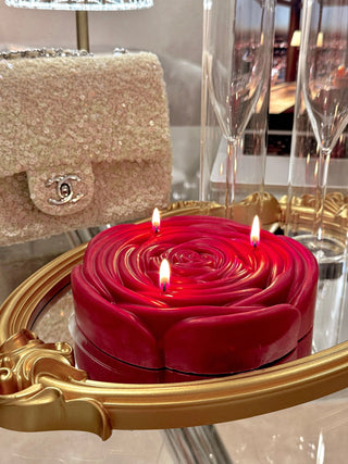 An up close view of the 3-Wick Brilliant Rose Candle in Red.