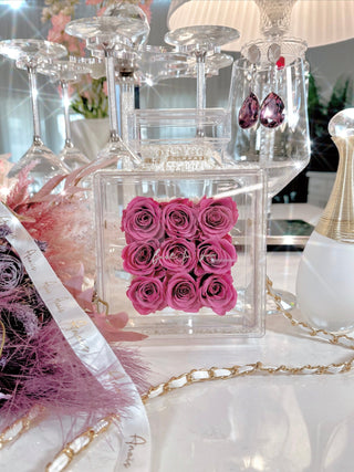Everlasting Roses in Parfum Box - Plum surrounded by Anaïs Candle gold ribbon.