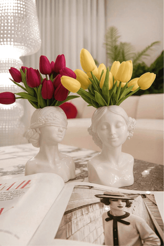 The "Rose & Ruby" Lady Ceramic Vase Set of 2 is waterproof.