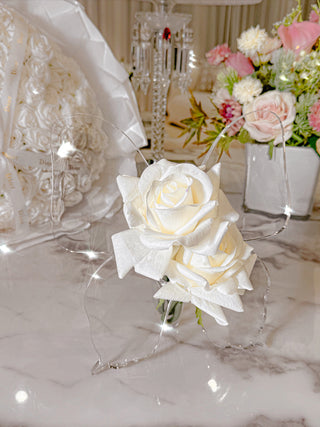 Château Butterfly Acrylic Vase decorated with faux white blooming flowers.