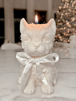 Puppy Glow Candle Set of 4 featuring a lit Charming Terrier Candle with an Anais bow.