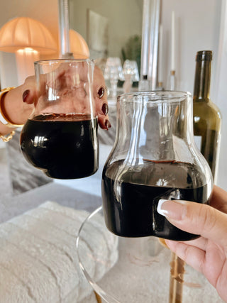 A loving couple toasts with the Lexi Female Glass Cup Set Of 2.