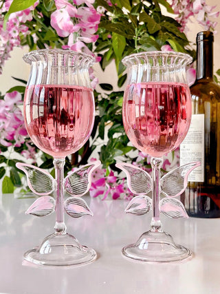 Dreamy Butterfly Champagne Flute Set of 2 filled with romantic pink champagne.