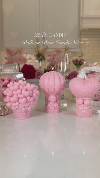 Balloon Bear Candle Set of 3 in French Rose Pink atop a marble kitchen island.
