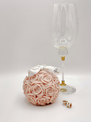 The Flower Romance in French Rose Pink, next to a luxurious glass wine flute.