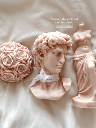 The Flower Romance in French Rose Pink, next to the Anaïs Man and Venus Candle Set.