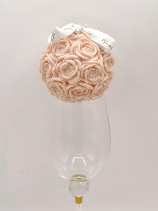 The Flower Romance in French Rose Pink, perched atop a luxurious glass wine flute.