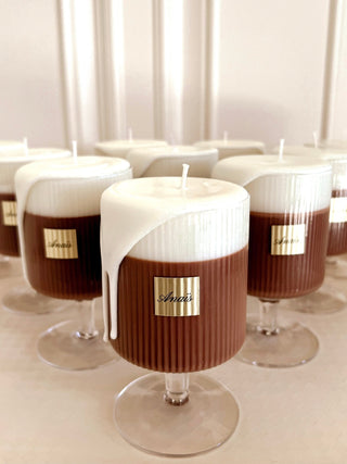 A batch of finely handcrafted French Latte Candles in a French cafe.