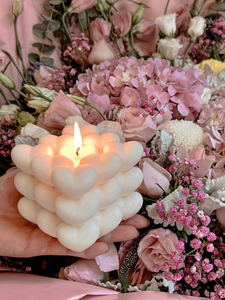 An “I Heart You” Candle with a lit flame.