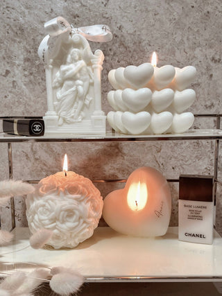 An “I Heart You” Candle next to other Anais candles.