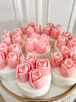 A gold and marble tray full of new Amélie Tulips Bouquet Candles.