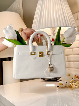 Victoria Handbag Resin Vase with gold lock and finishes.