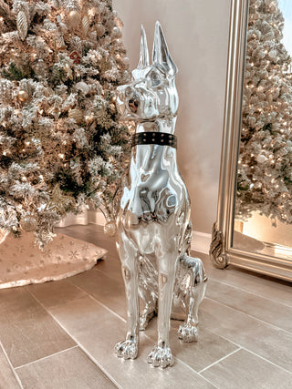 ‘LIMITED & EXCLUSIVE EDITION’ Luxurious Electroplated Doberman Dog Statue in front of lit Christmas Tree.